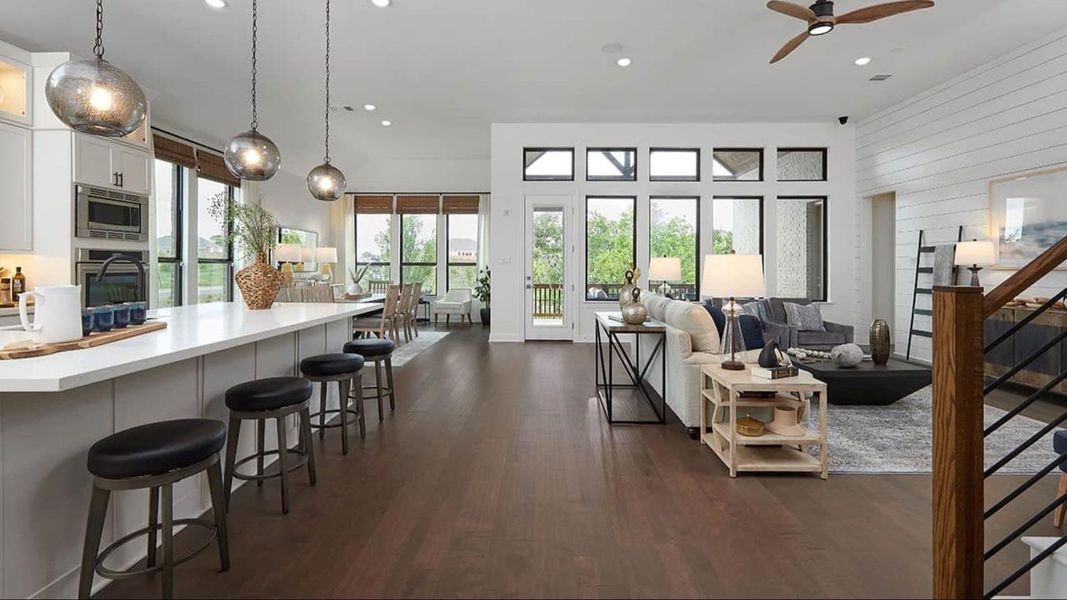 Living room featuring stairway, recessed lighting, dark wood finished floors, and ceiling fan