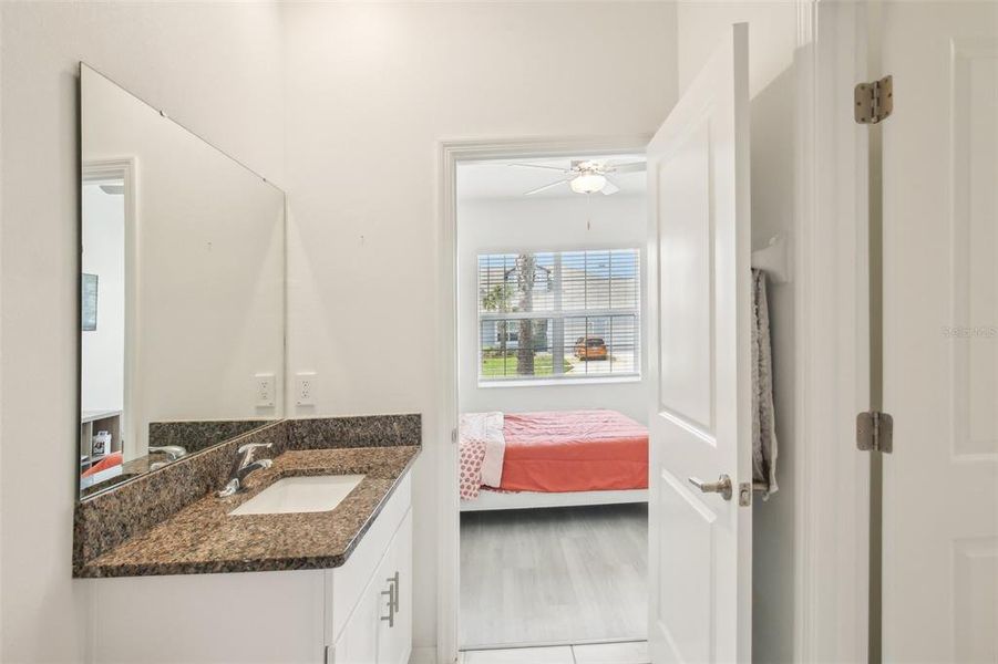 Guest bathroom with view into guest bedroom. Guest bathroom with view into guest bedroom.