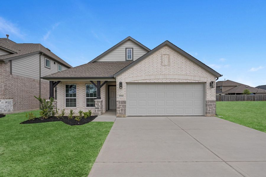 Front exterior of a new home in Barton Creek Ranch, Conroe, TX, highlighting curb appeal (Image 17).