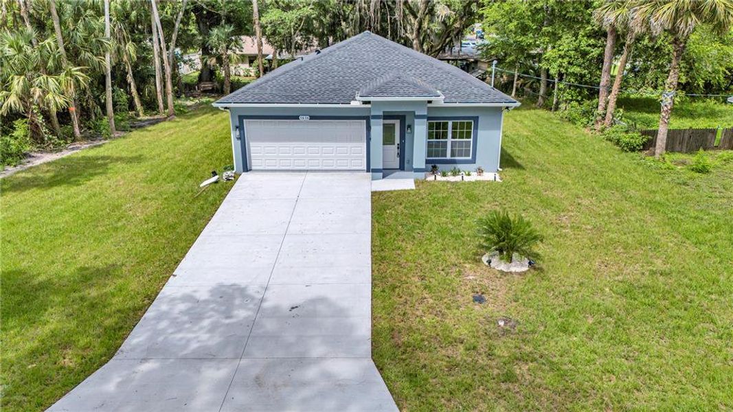 Front exterior of a new home in , Daytona Beach, FL, highlighting curb appeal (Image 17).