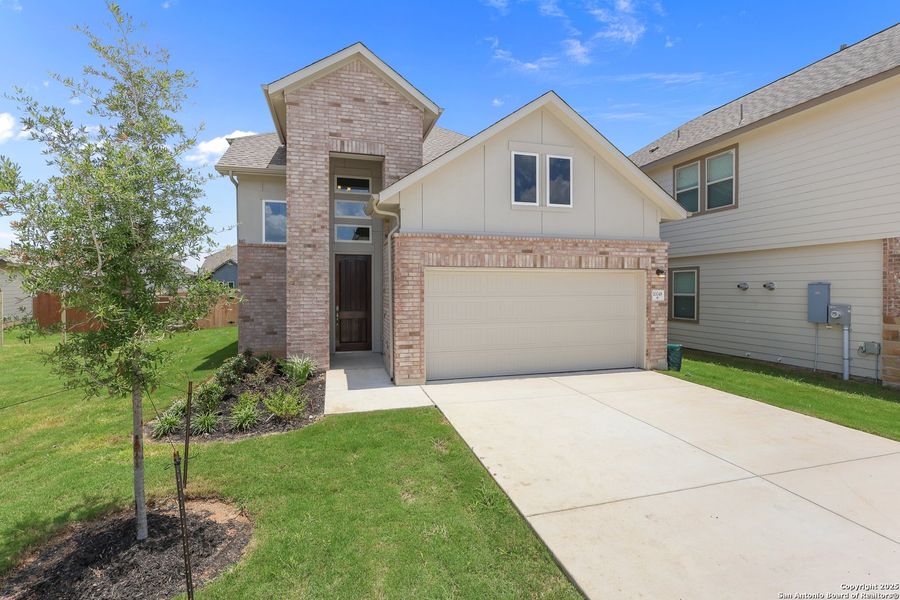 Front exterior of a new home in Rhine Valley, Schertz, TX, highlighting curb appeal (Image 20).