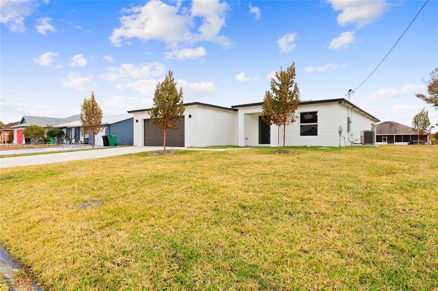 Front exterior of a new home in , Port St. Lucie, FL, highlighting curb appeal (Image 19). Front exterior of a new home in , Port St. Lucie, FL, highlighting curb appeal (Image 19).