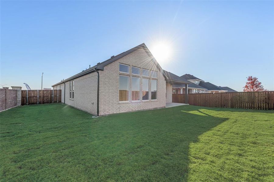 Exterior details and patio area of a home in Wildflower Ranch, Justin (Image 23).