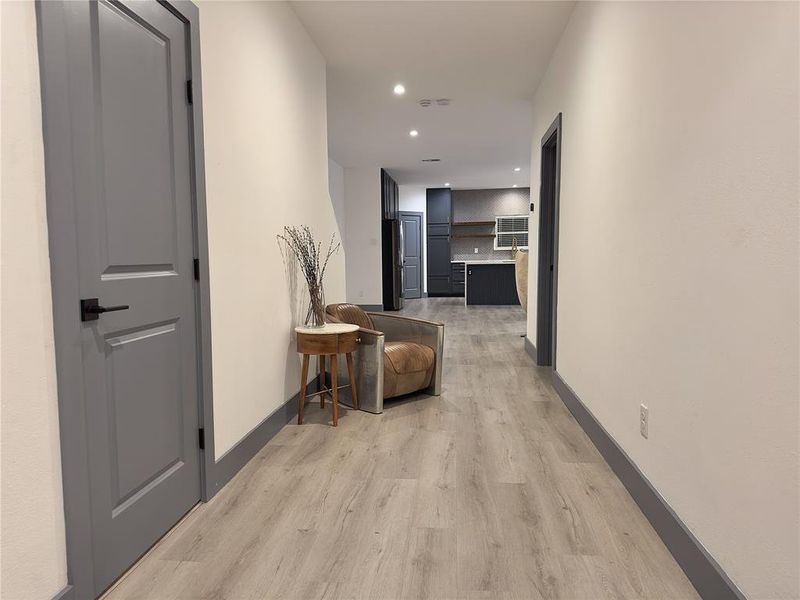 Hallway featuring light hardwood / wood-style flooring