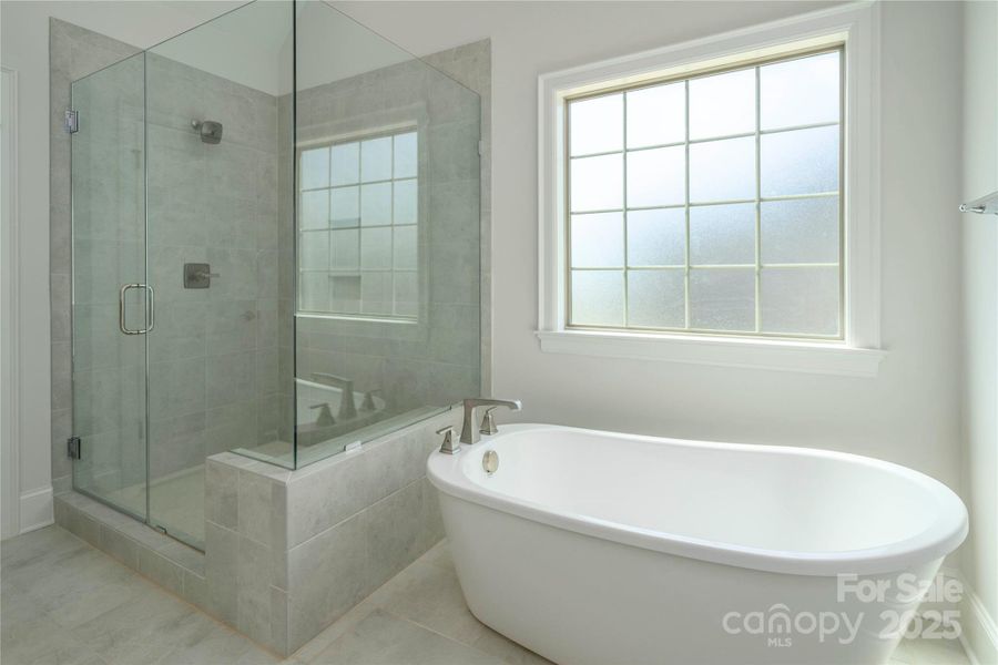 Please Note Photos are of completed home with similar finishes.   Plan to be reversed on this homesite