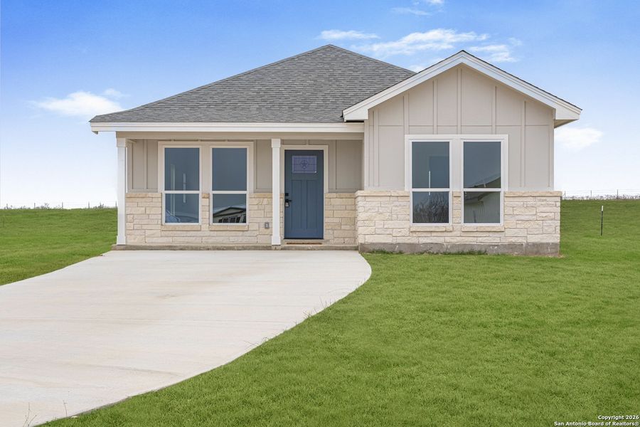 Front exterior of a new home in , La Vernia, TX, highlighting curb appeal (Image 19).