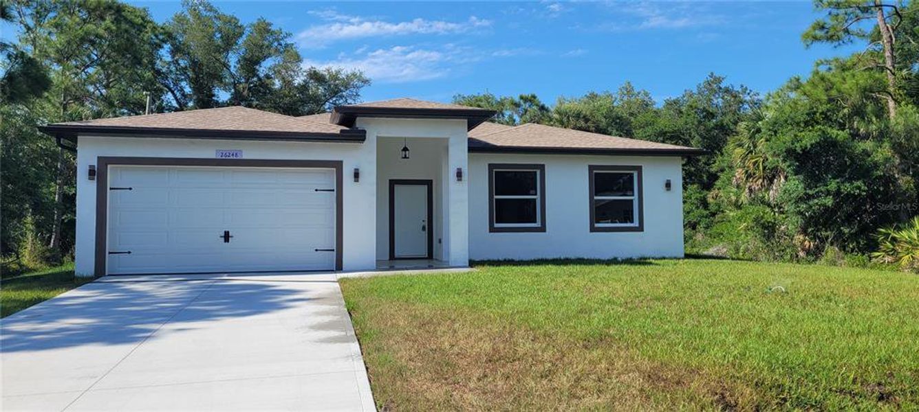Front exterior of a new home in , Punta Gorda, FL, highlighting curb appeal (Image 1). Front exterior of a new home in , Punta Gorda, FL, highlighting curb appeal (Image 1).