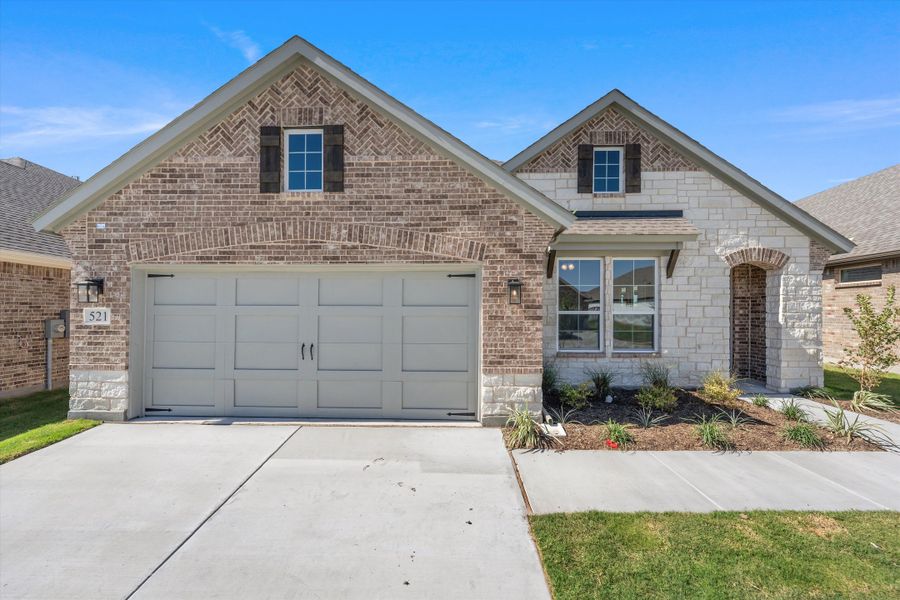 Front exterior of a new home in Morningstar, Aledo, TX, highlighting curb appeal (Image 2).
