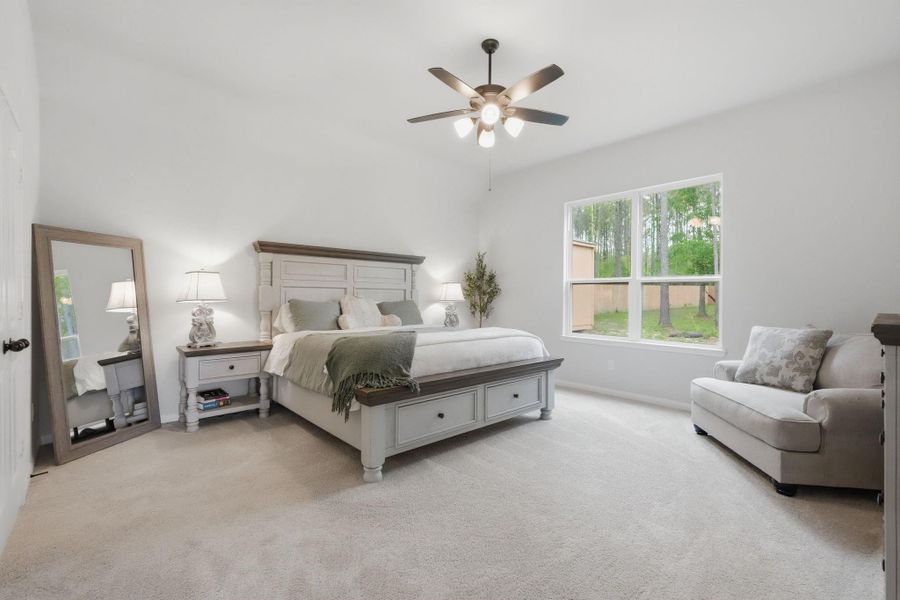 Private primary suite with direct access to the back patio and plenty of space to truly relax.