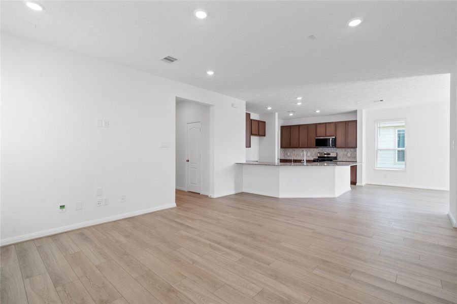 Beautiful open-concept layout effortlessly uniting the living, dining, and kitchen spaces—ideal for everyday comfort and entertaining guests! Beautiful open-concept layout effortlessly uniting the living, dining, and kitchen spaces—ideal for everyday comfort and entertaining guests!