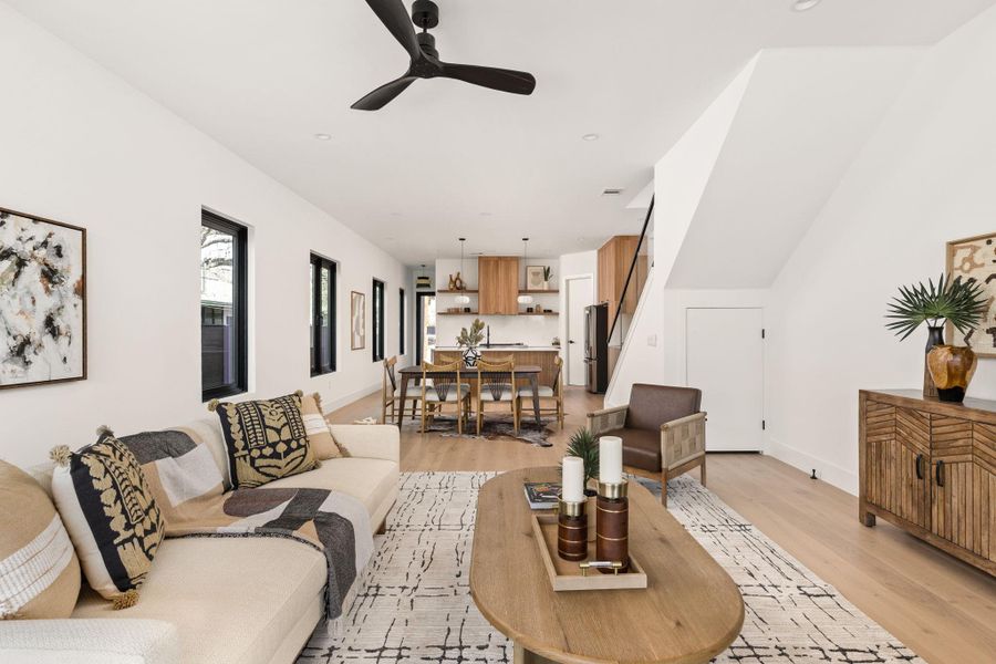 Living room featuring light wood-style floors and ceiling fan