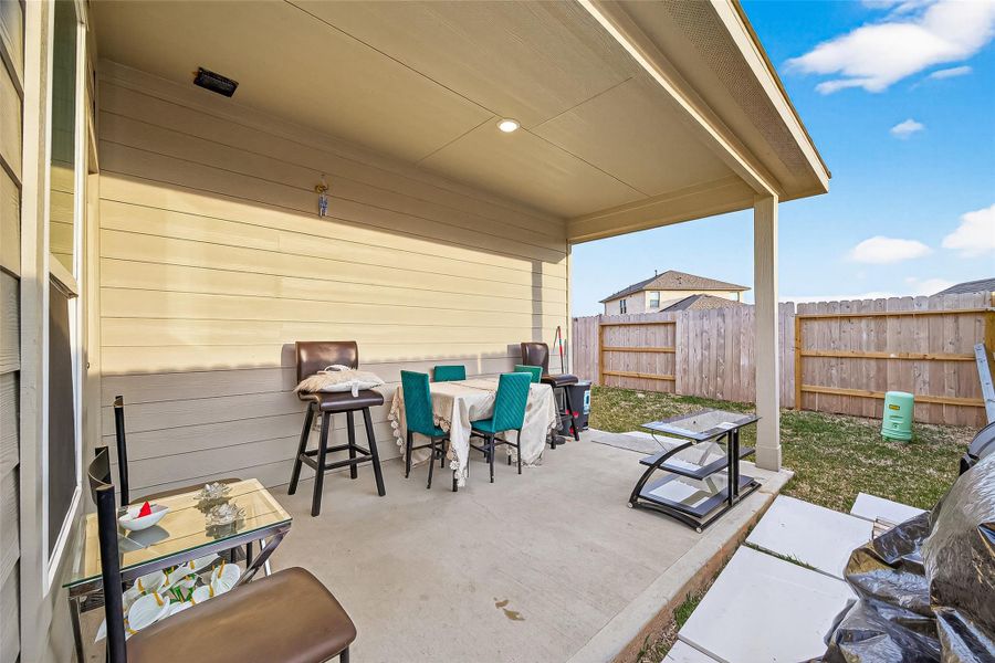 Exterior details and patio area of a home in Sunterra, Katy (Image 24).