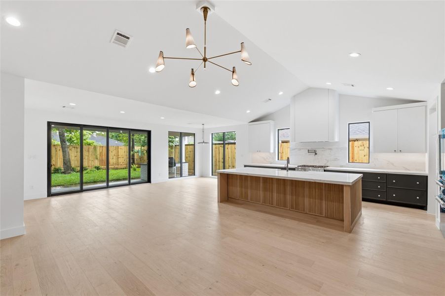 Gather with ease around the expansive island in this beautifully designed kitchen that blends luxury and practicality.