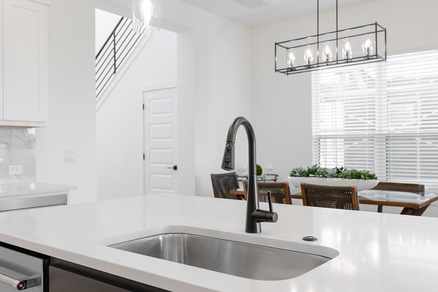 Open plan with island breakfast open to dining area.