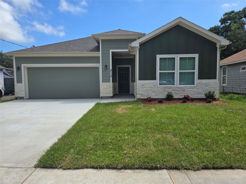 Front exterior of a new home in , Baytown, TX, highlighting curb appeal (Image 1). Front exterior of a new home in , Baytown, TX, highlighting curb appeal (Image 1).