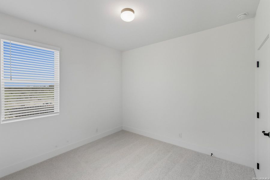 Spacious, unfurnished interior of a new home in Centero at Stone Oak, San Antonio (Image 23).
