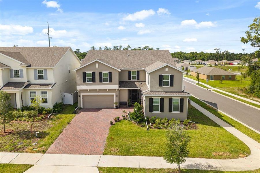 Front exterior of a new home in Beresford Woods, Deland, FL, highlighting curb appeal (Image 22). Front exterior of a new home in Beresford Woods, Deland, FL, highlighting curb appeal (Image 22).