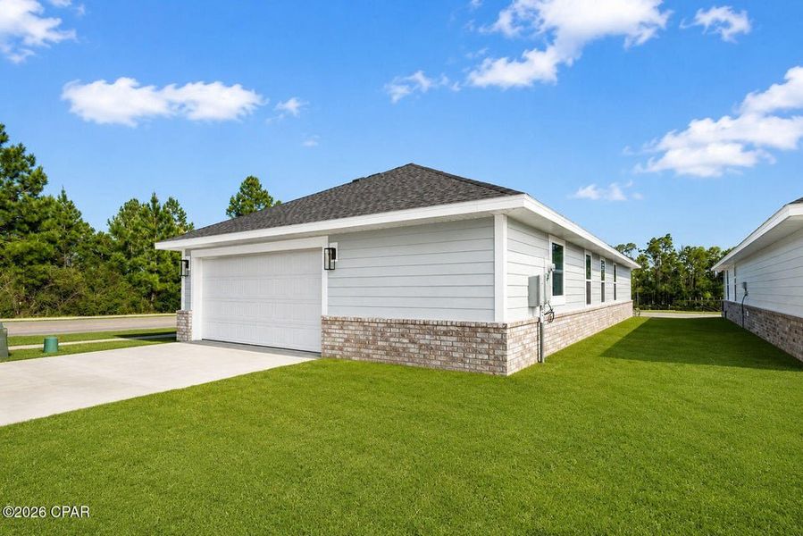 Front exterior of a new home in East Bay, Panama City, FL, highlighting curb appeal (Image 12).