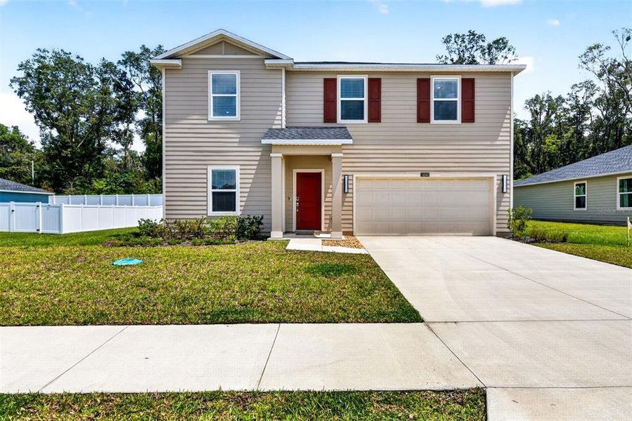 Front exterior of a new home in Tara Forest East, Alachua, FL, highlighting curb appeal (Image 30).