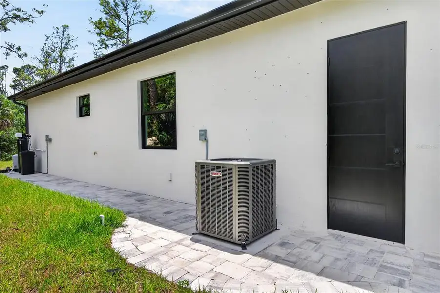 Exterior details and patio area of a home in , North Port (Image 47).