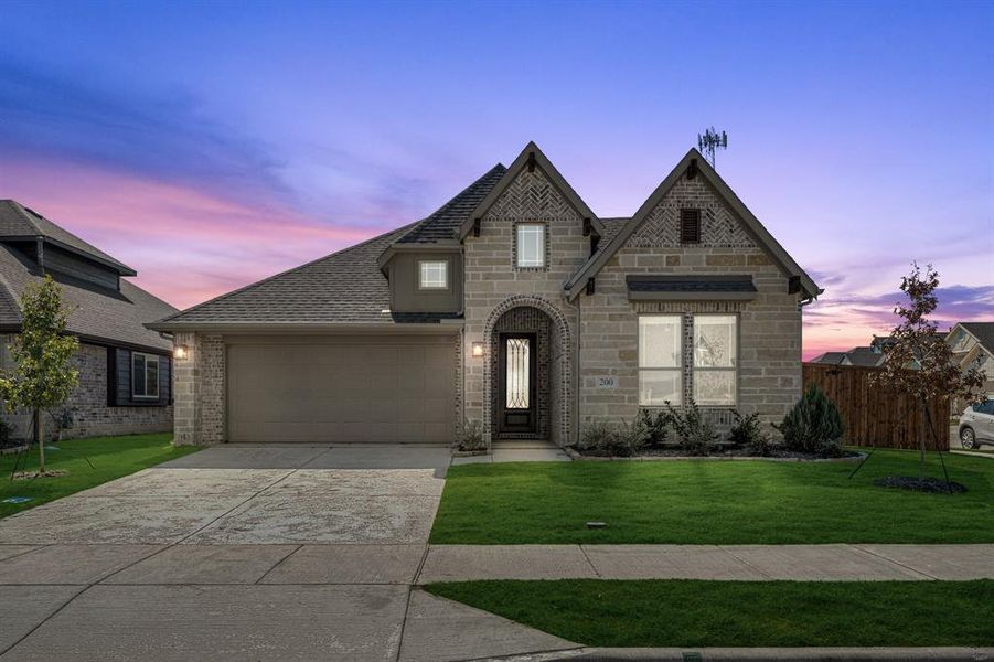 Front exterior of a new home in East Oak Creek 50-55, Commerce, TX, highlighting curb appeal (Image 2).