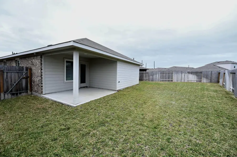 Exterior details and patio area of a home in Breckenridge Forest, Spring (Image 2).