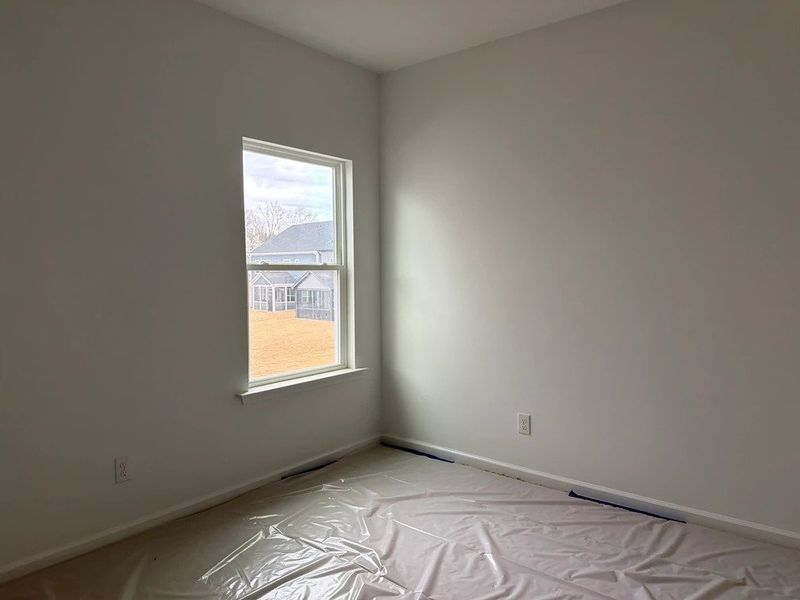 In-progress construction of a new home in Rowland's Grant, Fuquay Varina, NC (Image 22).