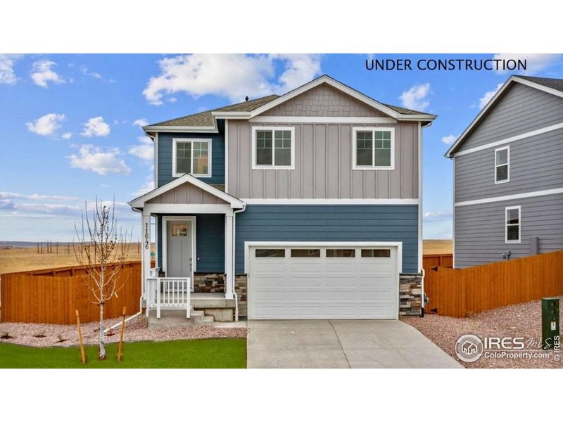 Front exterior of a new home in Prairie Song, Windsor, CO, highlighting curb appeal (Image 1). Front exterior of a new home in Prairie Song, Windsor, CO, highlighting curb appeal (Image 1).