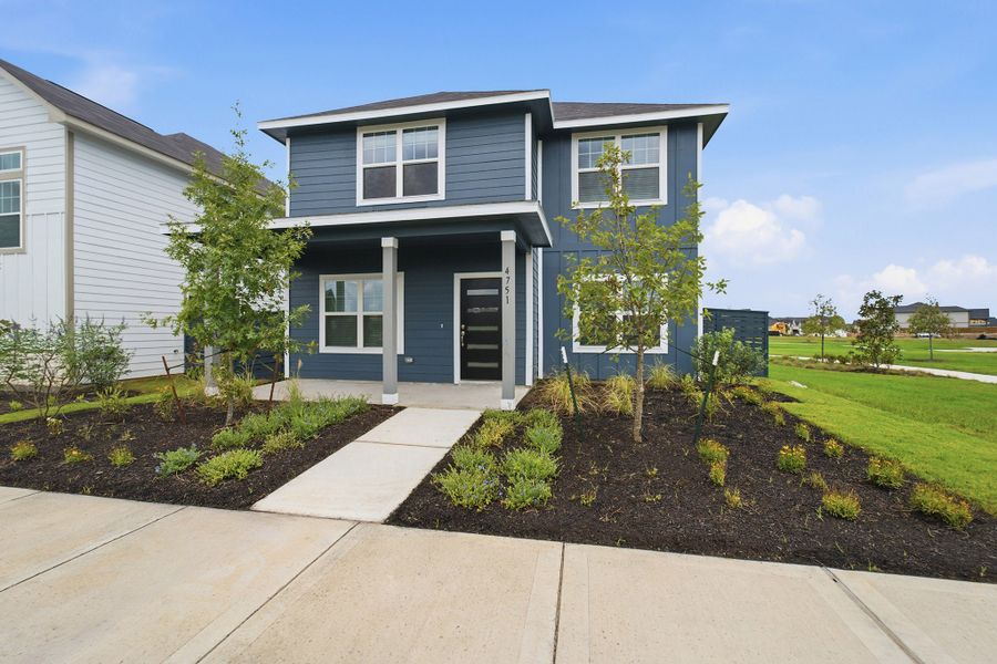 Front exterior of a new home in Austin Point, Richmond, TX, highlighting curb appeal (Image 26).
