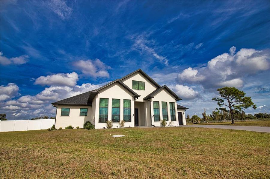 Front exterior of a new home in , Placida, FL, highlighting curb appeal (Image 22).