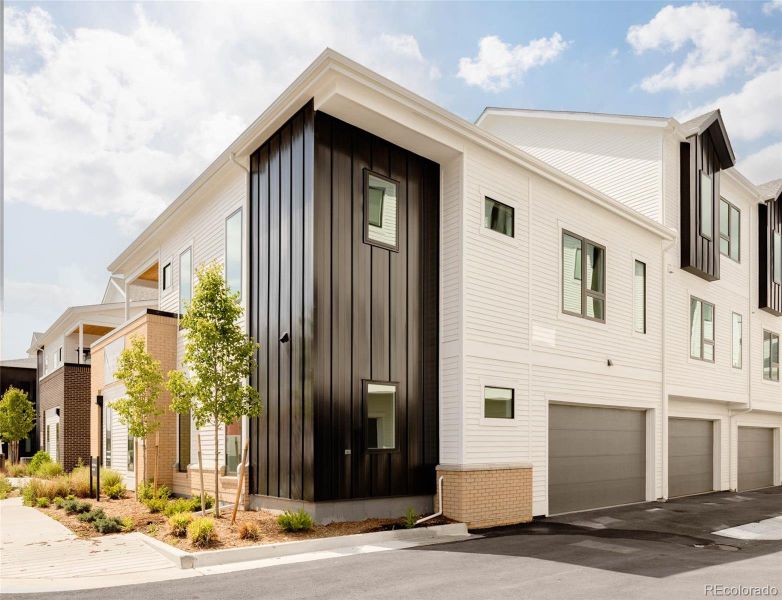 Front exterior of a new home in A Line Townhomes, Denver, CO, highlighting curb appeal (Image 24).