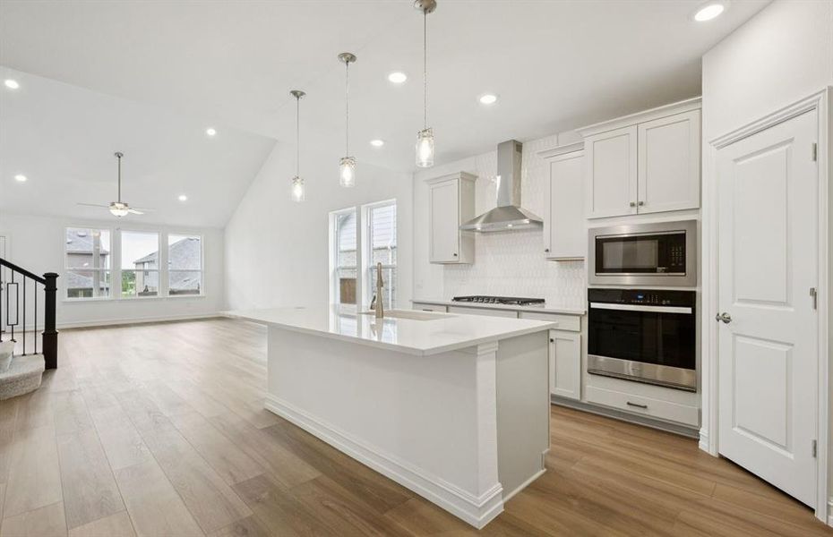 Airy kitchen with oversized island Airy kitchen with oversized island