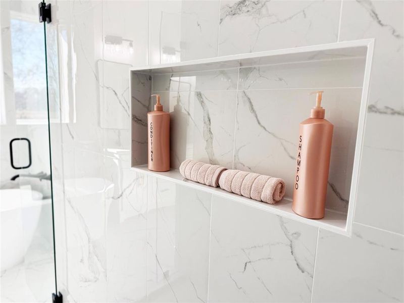 Bathroom view of a marble finish shower