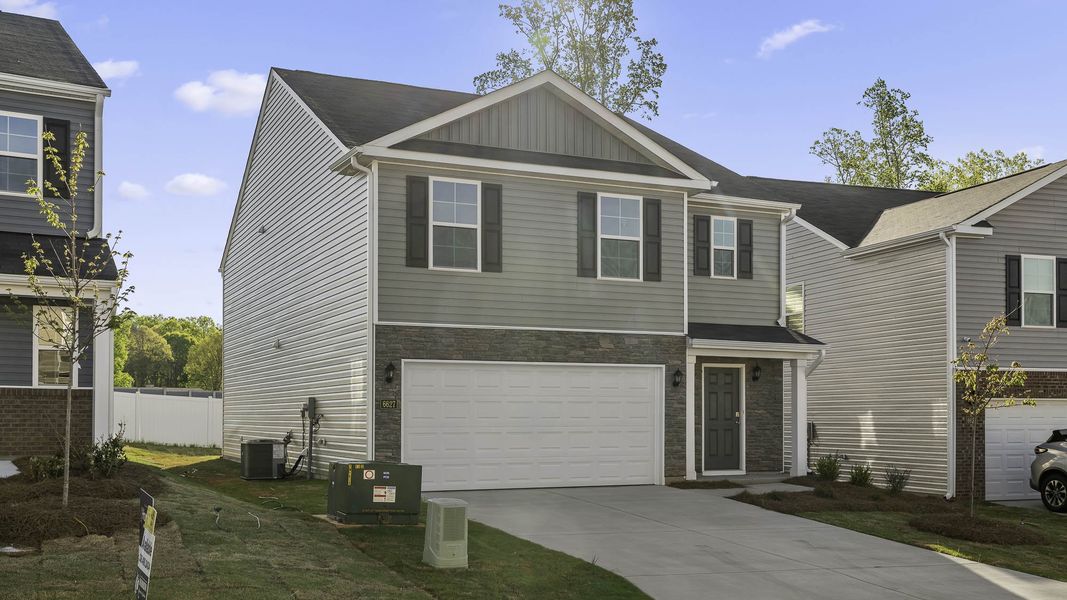 Front exterior of a new home in Willow Mill, Thomasville, NC, highlighting curb appeal (Image 17).