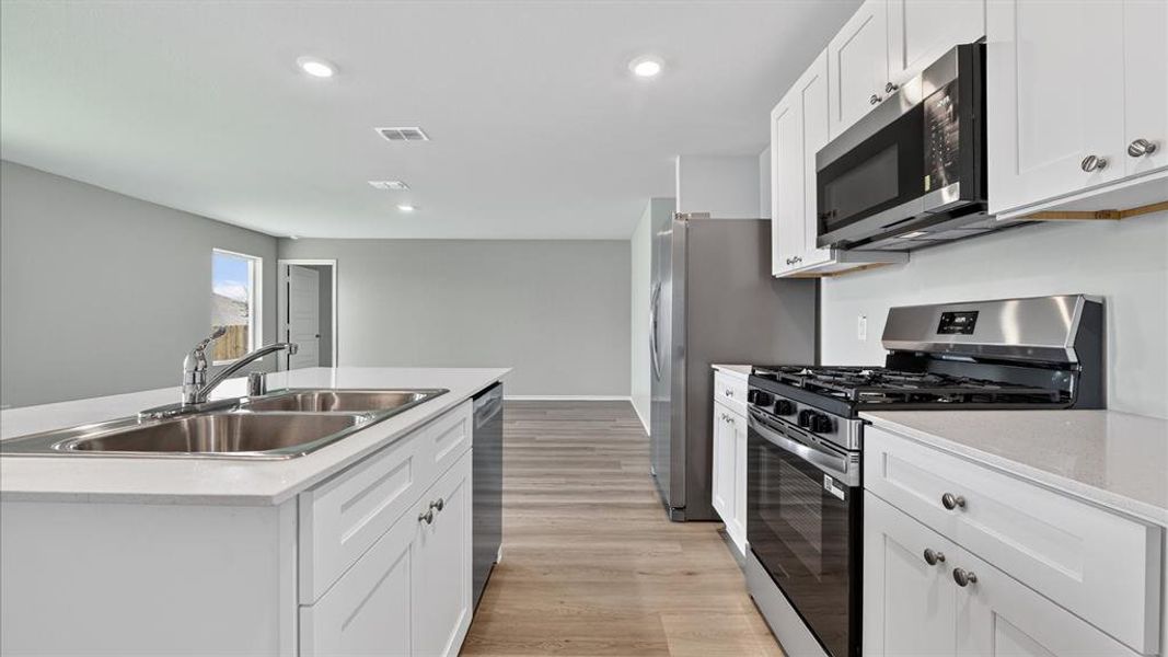 Kitchen - All Home and community information, including pricing, included features, terms, availability and amenities, are subject to change at any time without notice or obligation. All Drawings, pictures, photographs, video, square footages, floor plans, elevations, features, colors and sizes are approximate for illustration purposes only and will vary from the homes as built.