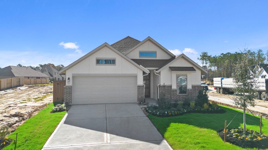 Front exterior of a new home in The Highlands 45', Porter, TX, highlighting curb appeal (Image 19).