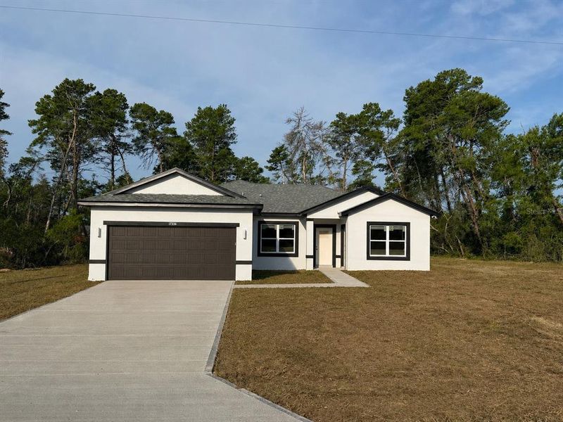 Front exterior of a new home in , Ocala, FL, highlighting curb appeal (Image 1). Front exterior of a new home in , Ocala, FL, highlighting curb appeal (Image 1).