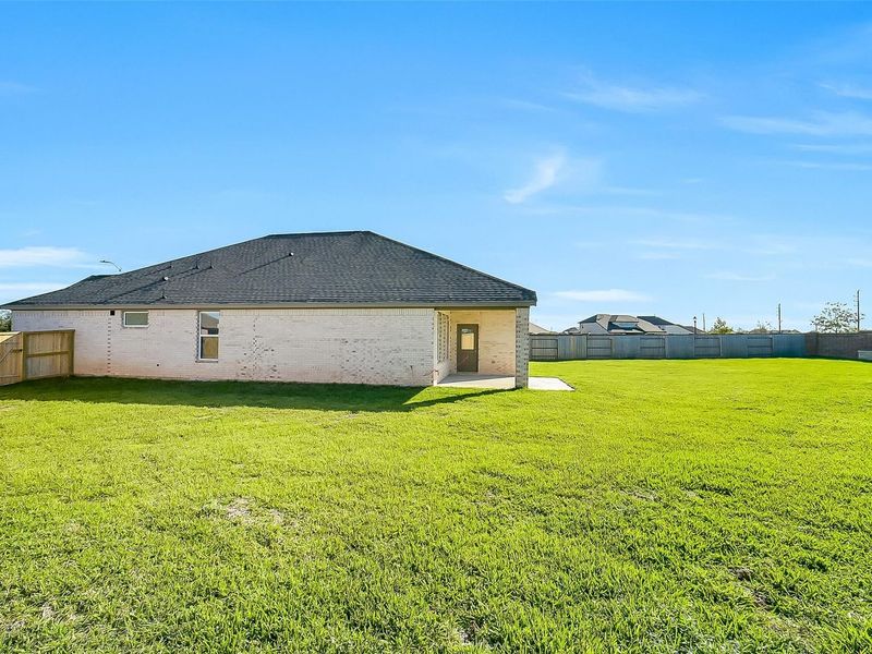 Exterior details and patio area of a home in Sunterra, Katy (Image 28).