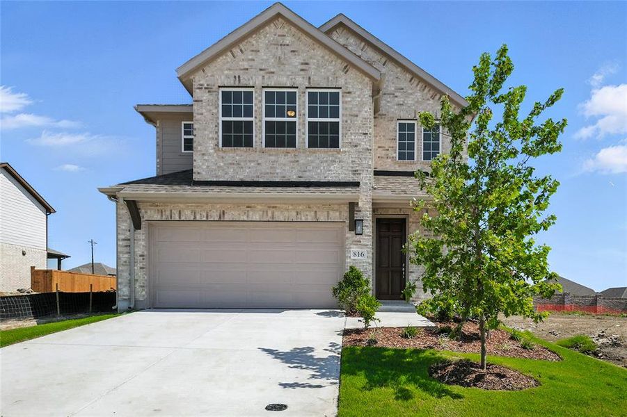 View of front of property with an attached garage, concrete driveway, and brick siding View of front of property with an attached garage, concrete driveway, and brick siding