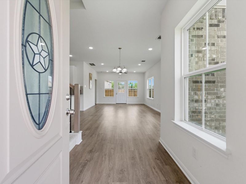 Step inside to soaring ceilings and sleek flooring that create an immediate sense of space and style from the moment you enter.