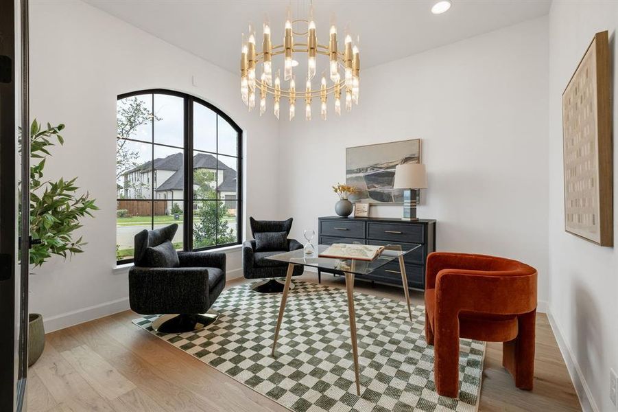 Sitting room with wood finished floors, a chandelier, and recessed lighting Sitting room with wood finished floors, a chandelier, and recessed lighting