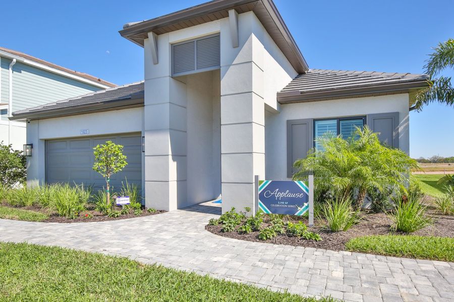 Representative exterior photo of a completed home built from the Applause by Neal Communities in Palm Grove, Bradenton, FL (Image 2). Representative exterior photo of a completed home built from the Applause by Neal Communities in Palm Grove, Bradenton, FL (Image 2).