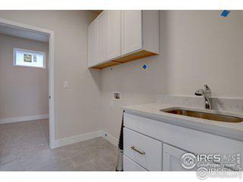 Laundry room with sink, from a similar finished home