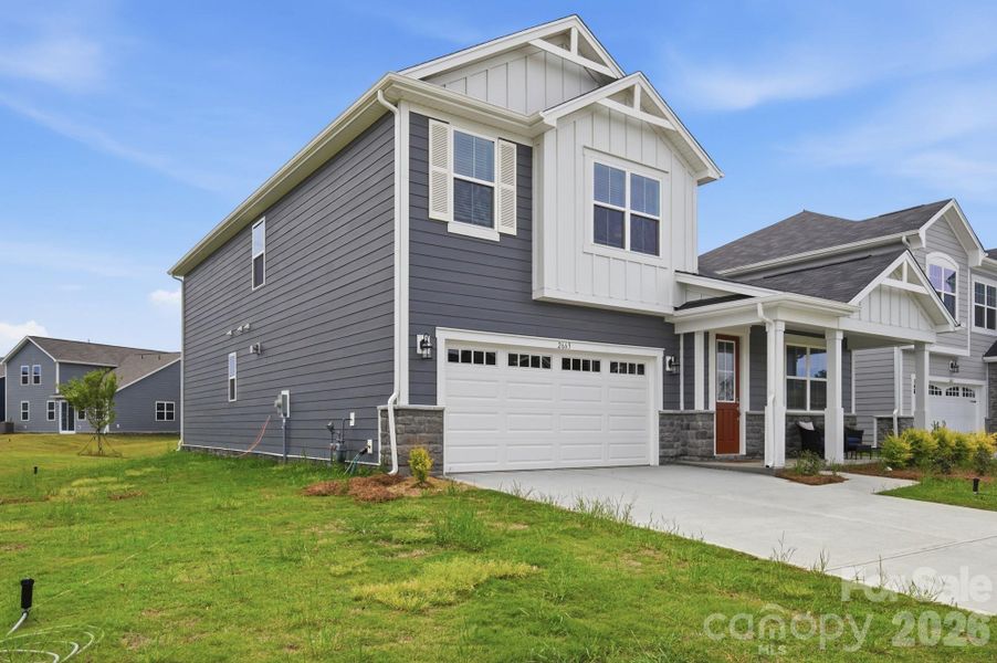 Front exterior of a new home in Waxhaw Landing, Monroe, NC, highlighting curb appeal (Image 2). Front exterior of a new home in Waxhaw Landing, Monroe, NC, highlighting curb appeal (Image 2).