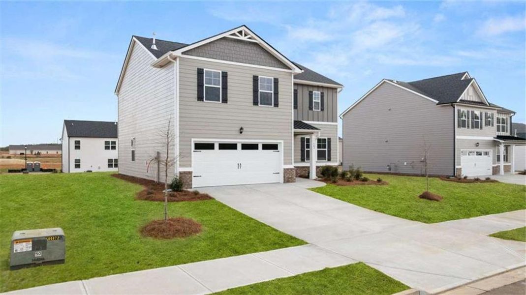 Front exterior of a new home in Preserve at Dove Creek, Statham, GA, highlighting curb appeal (Image 24).