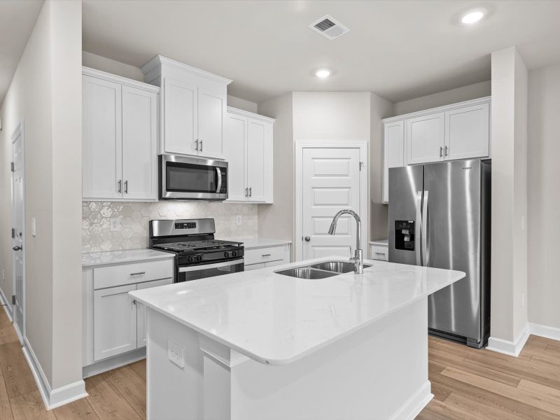 Furnished interior view inside a new home in Crossing at Abner Creek Townes, Greer (Image 4).