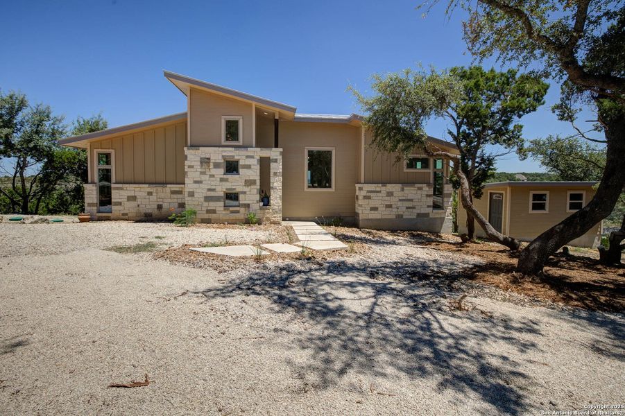 Front exterior of a new home in , New Braunfels, TX, highlighting curb appeal (Image 21). Front exterior of a new home in , New Braunfels, TX, highlighting curb appeal (Image 21).