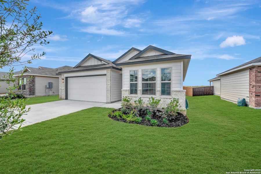 Front exterior of a new home in Greenspoint Heights, Seguin, TX, highlighting curb appeal (Image 21).