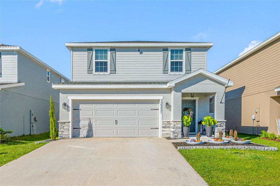 Front exterior of a new home in , Riverview, FL, highlighting curb appeal (Image 26). Front exterior of a new home in , Riverview, FL, highlighting curb appeal (Image 26).