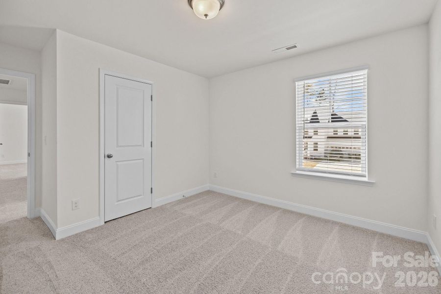 Secondary BedroomPhotos are representative and may not reflect the exact home, finishes, or features.